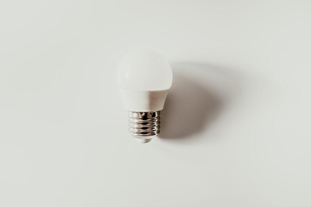 Database tutorial for beginners, lightbulb on white background